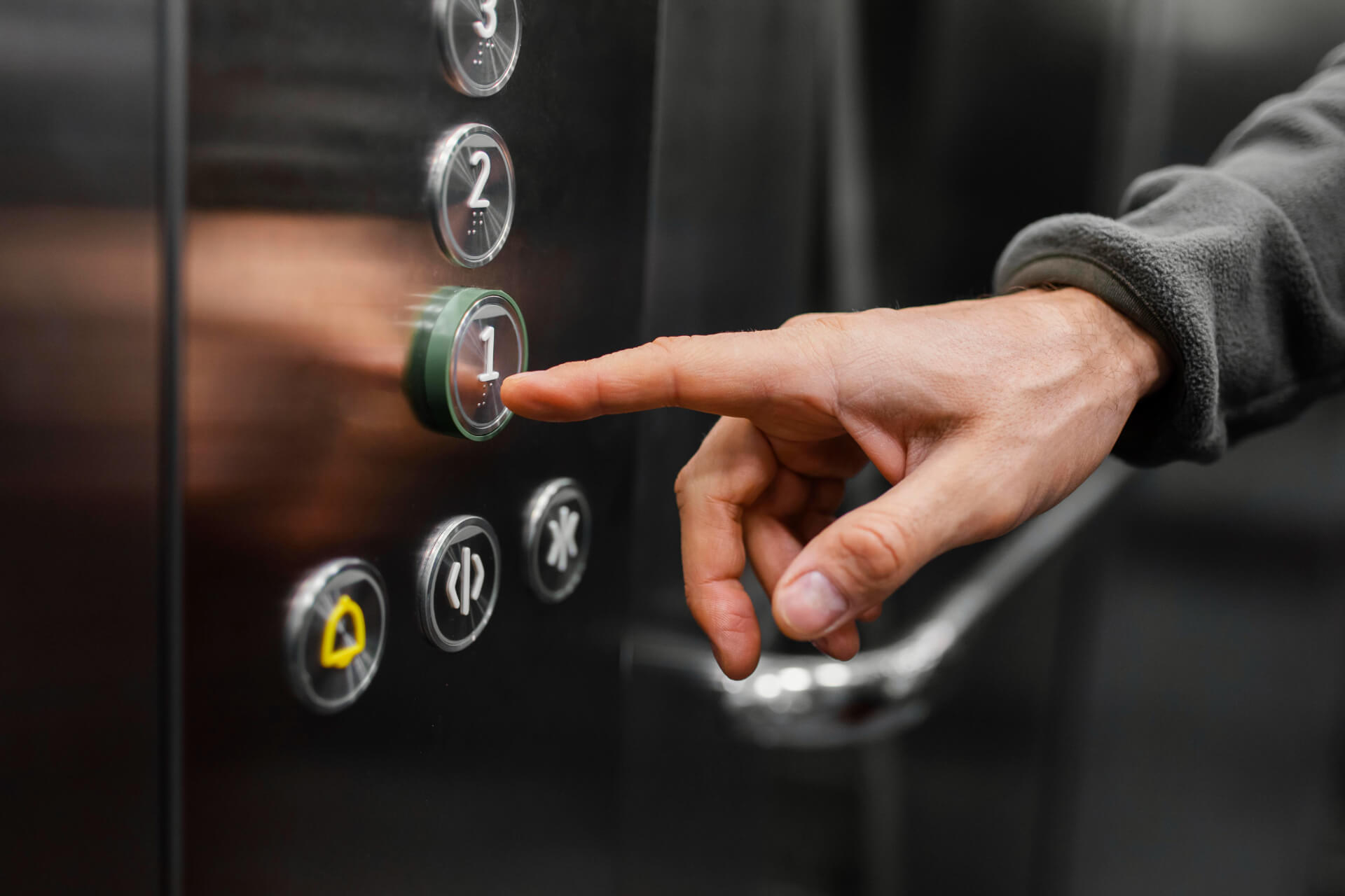 delivery-man-with-package-elevator-close-up