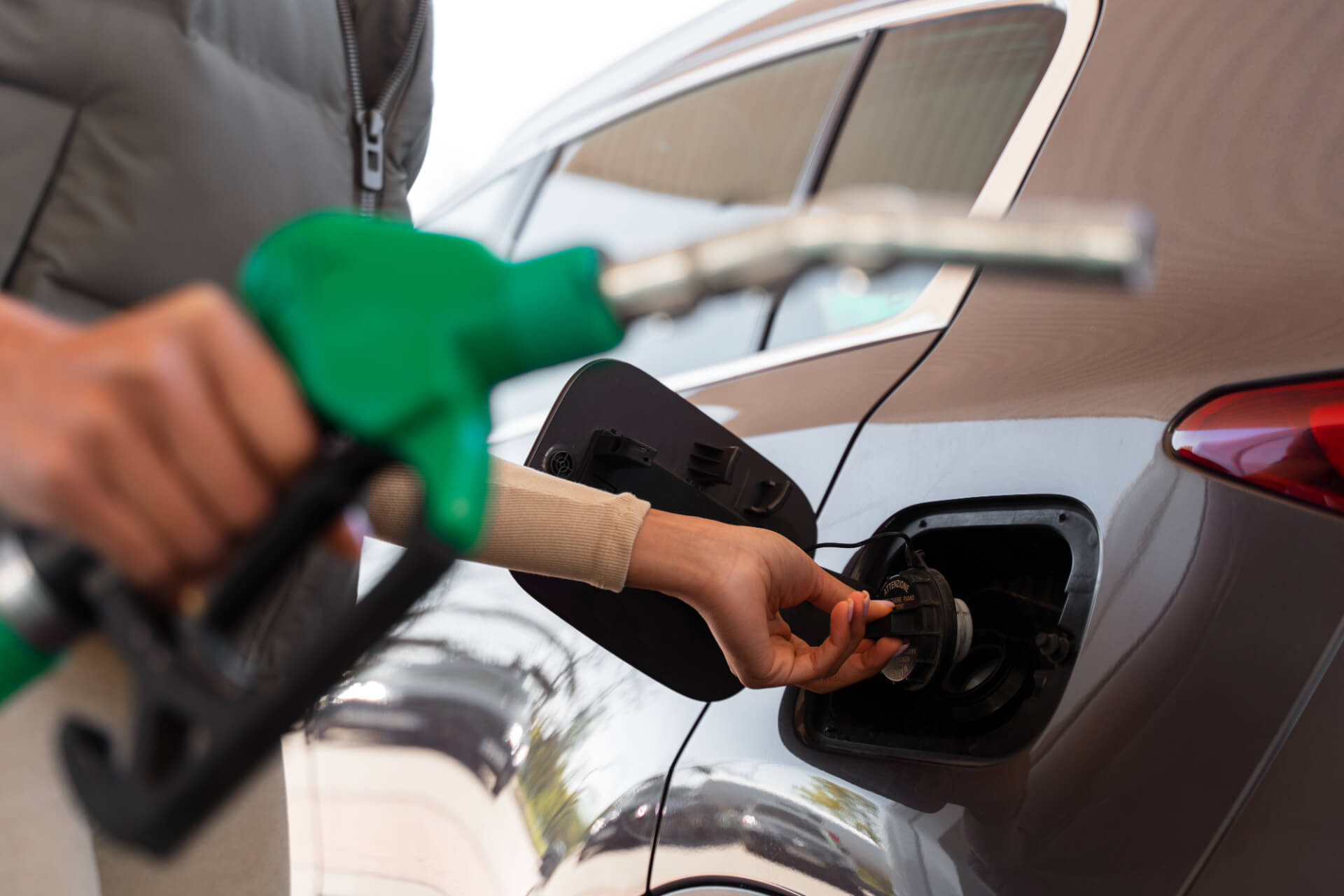 view-woman-with-car-gas-station